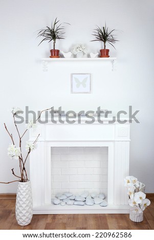 Fireplace with beautiful decorations in comfortable living room