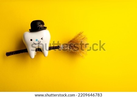 Happy halloween.dental concept.spider web pumpkin.dental tools on yellow