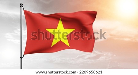 Vietnam national flag cloth fabric waving on beautiful grey sky.