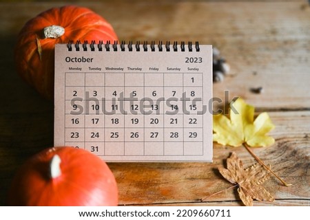 October calendar. Place for text. Pumpkins on the background. Fall vibes. Cozy autumn style. Royalty-Free Stock Photo #2209660711