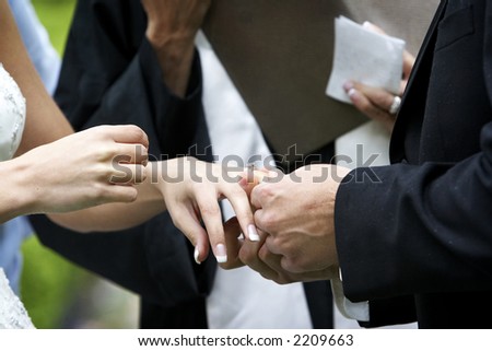 Putting the ring on the bride during a wedding ceremony
