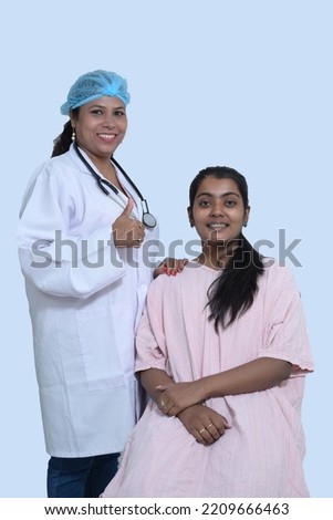 Portrait of a female doctor doing health checkup of her patient