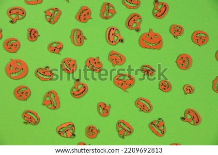 Halloween carved in wood orange Pumpkins pattern on the green screen background. 