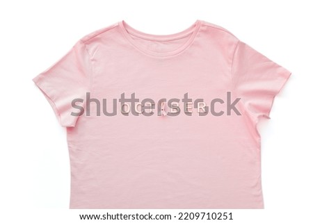 Pink woman's t-shirt with word October for breast cancer awareness