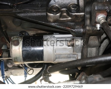Replace the parts of the starter motor of the old car Royalty-Free Stock Photo #2209729469