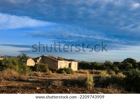Abandoned house in the countryside under beautiful sky in Spain