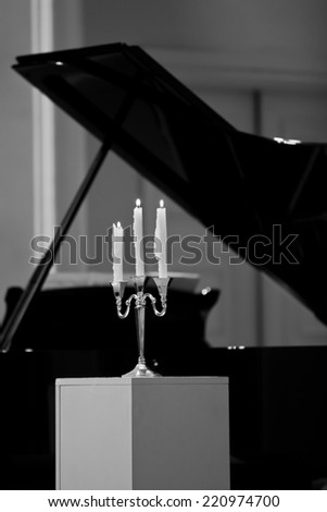 Candelabra on the piano background fragment