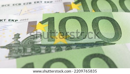 Banknotes of 100 euros closeup. Horizontal stories on the theme of the economy and finance of the European Union. News about euro. Eurozone currency and ECB. Banking in Europe. Macro Royalty-Free Stock Photo #2209765835