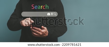 Man hands searching word by written in search bar or search box on virtual screen, browsing Internet global data Information.