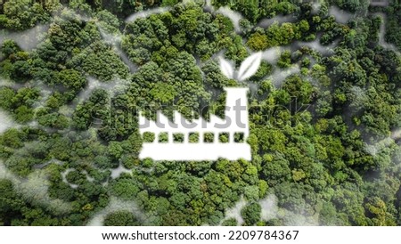 industry of environment Environmentally friendly production concept, conservation of white mist in the shape of a factory in the middle of a lush forest.