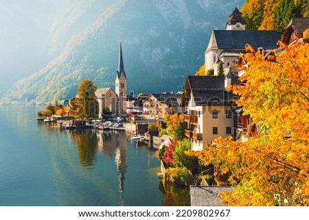 Hallstatt village in Austrian Alps. Houses and mountains are reflected in the lake. Beautiful autumn landscape Royalty-Free Stock Photo #2209802967