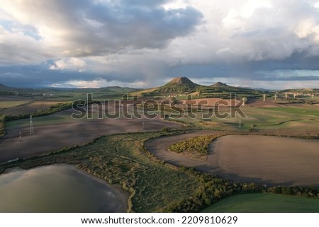 Ceske stredohori- also known as Central Bohemian Uplands or Central Bohemian Highlands, is a geomorphological region in northern Bohemia,aerial panorama view on Oblik and Rana hills by Louny,Czech rep