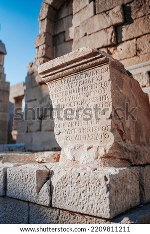 Ancient Greek inscription on the stone of the ancient city.
Ancient greek writing on stone. Patara, Antalya, Turkey Royalty-Free Stock Photo #2209811211