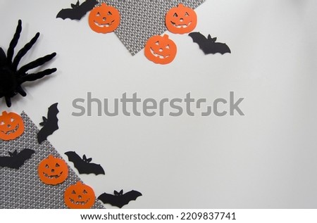 Halloween background. Orange pumpkins, bats and black spider isolated on white background.