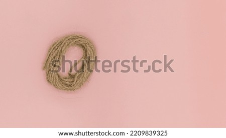 Closeup rope on pink background isolated, Abstract ropes, cables, hems isolated on pink background,
