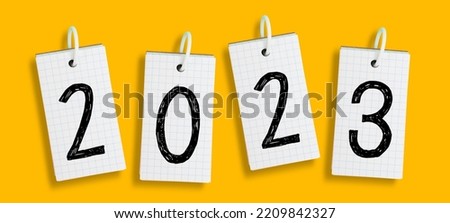 Note papers with New Year 2023 on yellow background