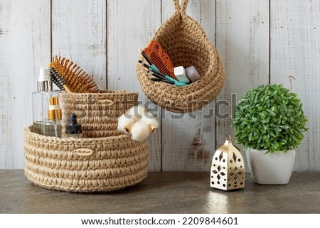 hand-knitted jute boxes for accessories and cosmetics, Scandinavian style, zero waste storage, eco-friendly, natural and recyclable materials, cozy interior with baskets for bathroom acce Royalty-Free Stock Photo #2209844601