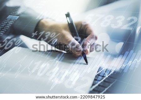 Double exposure of abstract creative financial diagram with hand writing in notebook on background, banking and accounting concept