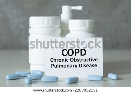 Copd words written on white medical card, medical pills. Medical and healthcare concept.