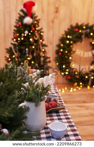 New Year and Christmas backyard decorations. Christmas tree, wreath and gifts. Winter holidays and celebrations.