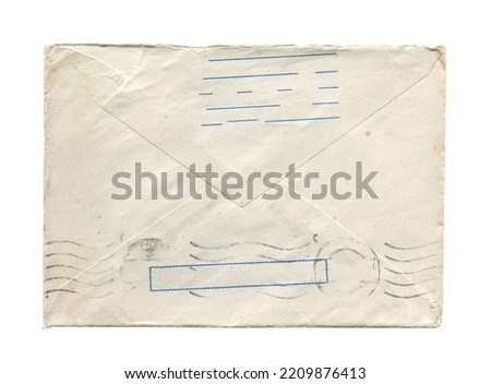 front view closeup of blank old aged vintage closed letter paper postage envelope with torn edges faded stamp print and wrinkled grunge texture isolated on white background