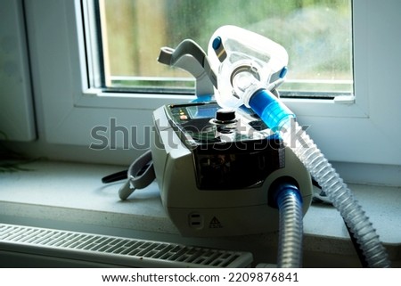 non invasive ventilator (niv) with mask used by patients with respiratory problems at home Royalty-Free Stock Photo #2209876841