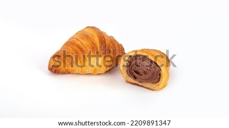 Fresh croissants with chocolate. Croissant with chocolate filling with shadows on a white background. Fresh french croissant. Italian pastry Royalty-Free Stock Photo #2209891347