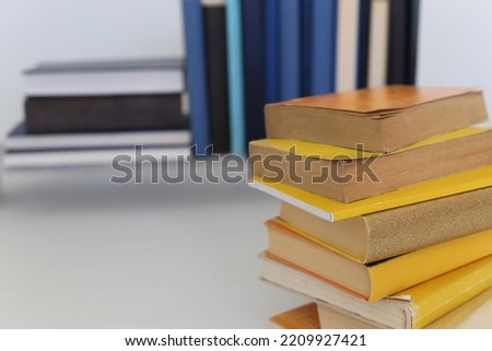 Yellow and blue books on a white background