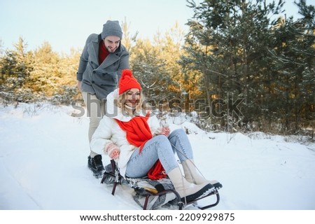 Photo of young attractive couple happy positive smile look each other enjoy time together forest winter love story