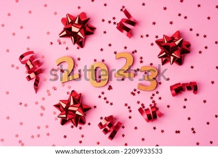 Christmas, winter, new year concept. Merry Christmas and Happy New Year. Christmas, winter, new year concept. Holiday. Happy New Year 2023 poster. Christmas background with big gold 2023 numbers. 