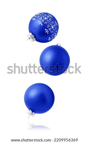 Christmas ornaments isolated on white background. Set of three falling blue christmas balls.
