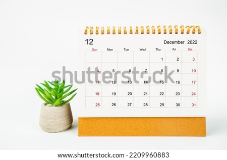 December 2022 Monthly desk calendar for 2022 year with plant pot isolated on white background. Royalty-Free Stock Photo #2209960883