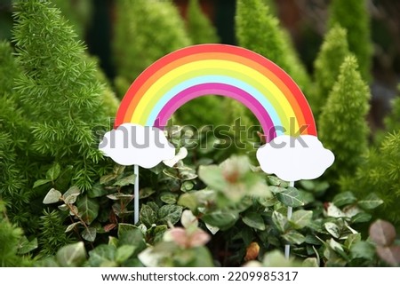 beautiful summer rainbow，isolated rainbow with flowers flat design modern colors.