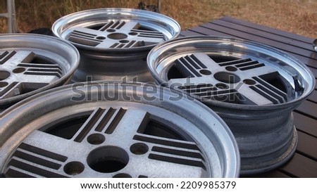 Genuine tire wheels of an old vintage car Royalty-Free Stock Photo #2209985379