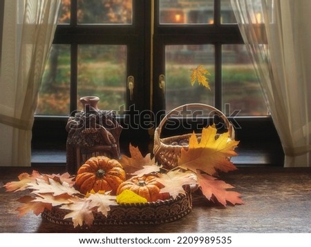 Still life with pumpkins and autumn leaves