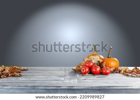 Desk of free space and autumn background. 
