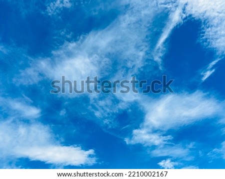 Beautiful blue sky with lovely white clouds and the light of sun on a sunny day