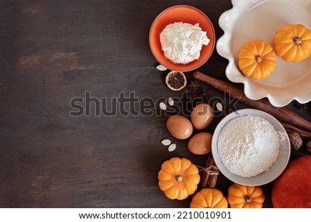 Fall pie baking ingredients with pumpkins, nuts, seasonal spices and tools. Pumpkin pie recipe idea. Thanksgiving and autumn holidays celebration concept. Top view, flatlay