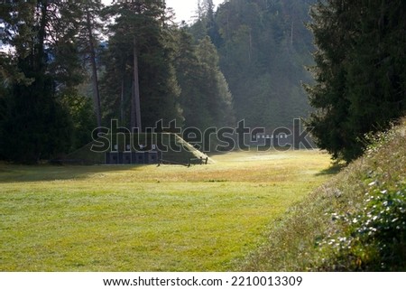 Scenic view of shooting range in the woods at mountain village Versam. Canton Graubünden, on a sunny autumn morning. Photo taken September 26th, 2022, Versam, Switzerland. Royalty-Free Stock Photo #2210013309