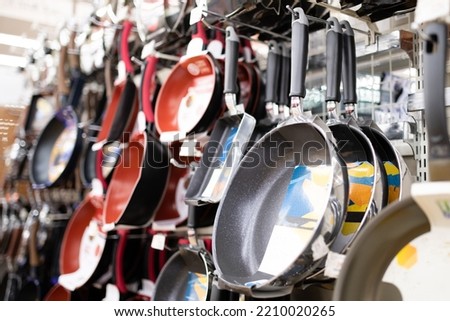 A lot of frying pans for sale