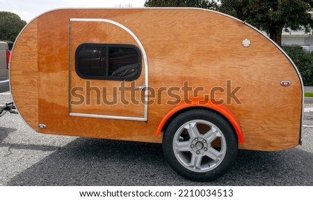 Plywood tear drop camping trailer. Royalty-Free Stock Photo #2210034513