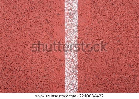 Running track red ground rubber cover with white stripe