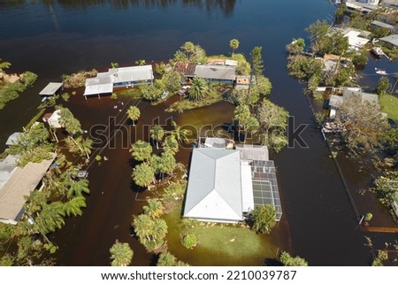 Hurricane Ian flooded houses in Florida residential area. Natural disaster and its consequences Royalty-Free Stock Photo #2210039787