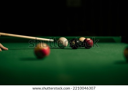Cue ball eight ball and pool cue Royalty-Free Stock Photo #2210046307
