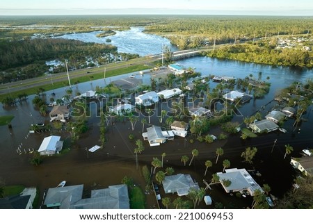 Hurricane Ian flooded houses in Florida residential area. Natural disaster and its consequences Royalty-Free Stock Photo #2210069453