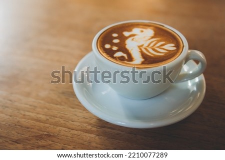 Beautiful latte in a cafe. Beautiful hot coffee. Beautiful latte pattern in a coffee shop.