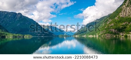 Panoramic view of beautiful fjord and mountains. Beautiful reflection. Location: Scandinavian Mountains, Norway. Artistic picture. Beauty world. The feeling of complete freedom