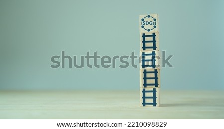 Sustainable development goals. SDGs. concept. The 2030 Agenda for sustainable development. Developed in cooperation with UN system. Wooden cubes with SDGs strategy and alignment policy icons. Royalty-Free Stock Photo #2210098829