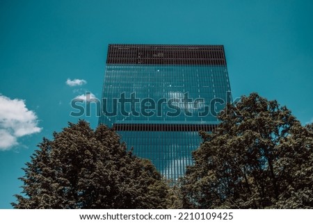 Beautiful garden on rooftop of modern glass building, concept for corporate buildings. High quality photo