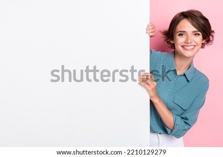 Photo of pretty cheerful lady arm touch hold blank empty space isolated on pink color background